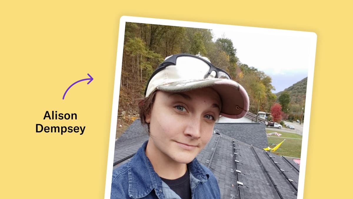 Selfie of Alison Dempsey on a roof. She wears a white baseball cap with safety glass on top of the brim, and a denim button up. The photo is overlaid on a yellow background with the text 'Alison Dempsey' and a purple arrow pointing to the image.