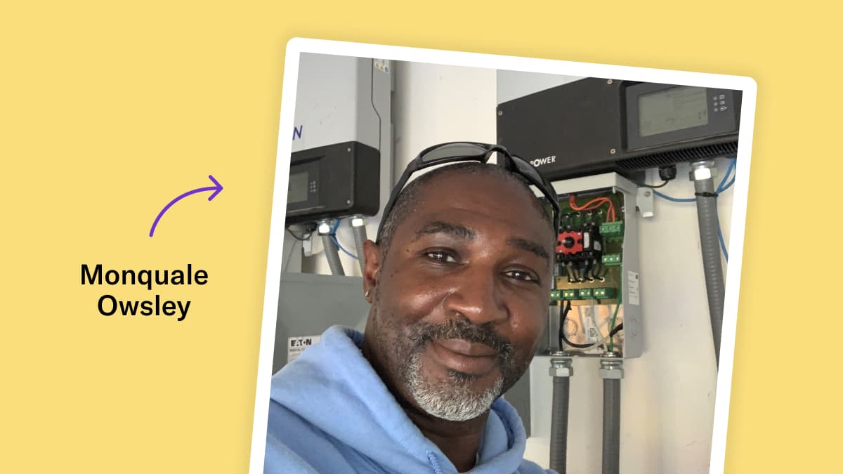 Polaroid-style photo of Monquale Owsley in front of a solar inverter. He is smiling at the camera, has gray facial hair, is wearing a light blue hoodie and safety glasses on the top of his head. The photo is on top of a yellow background with a purple arrow pointing to the polaroid with the text "Monquale Owsley".